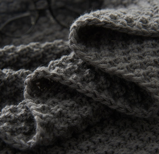 Close-up of dark gray textured fabric