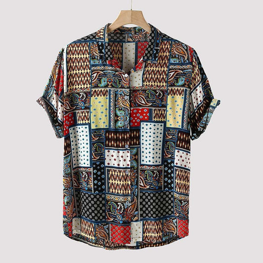 Colorful patterned shirt on a hanger against a light gray background
