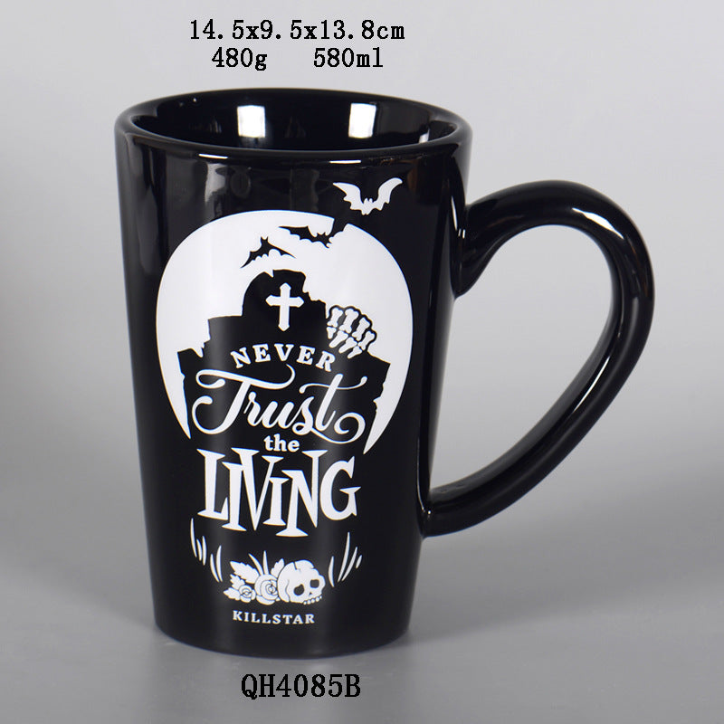 Black mug with white graphic and text on a gray background