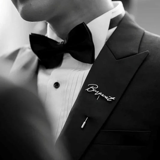 Black tuxedo with a bow tie and 'Bogart' branding on a blurred background