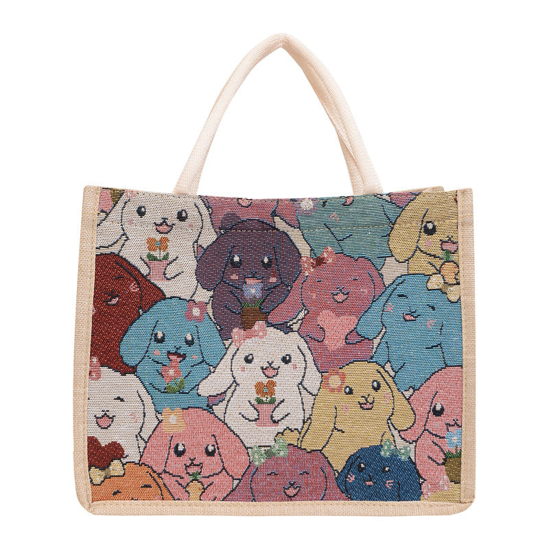 Tote bag with colorful animal illustrations on a white background