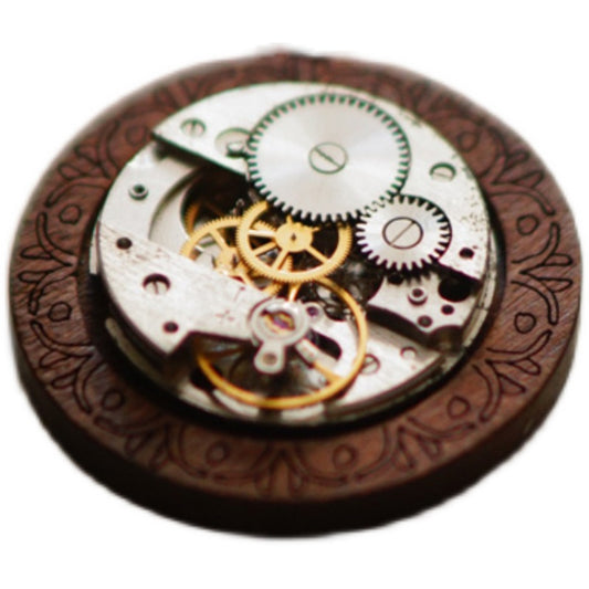Close-up of a mechanical watch movement with wooden casing
