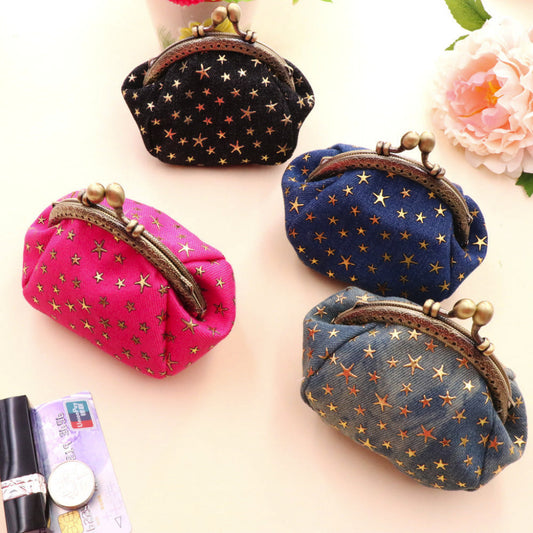 Four small bags with star patterns on a light background