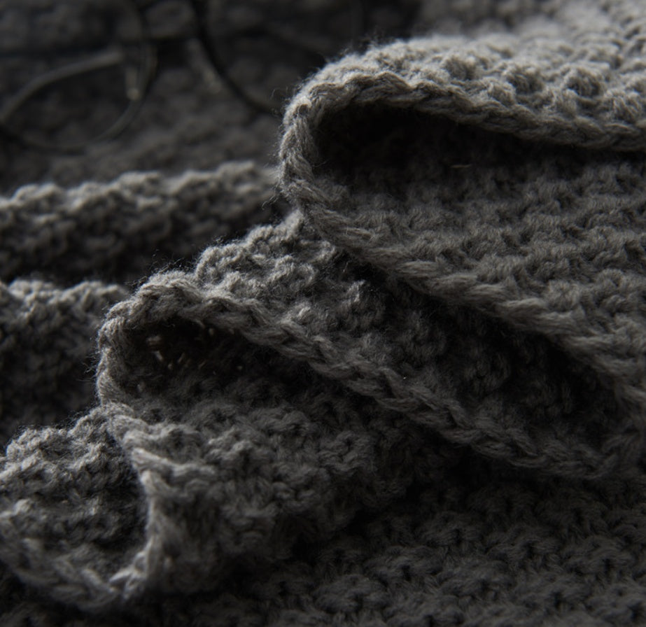 Close-up of dark gray textured fabric