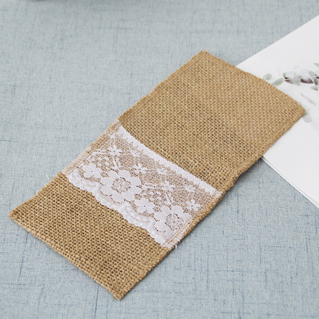 Rectangular mat with burlap and lace design on a light gray surface
