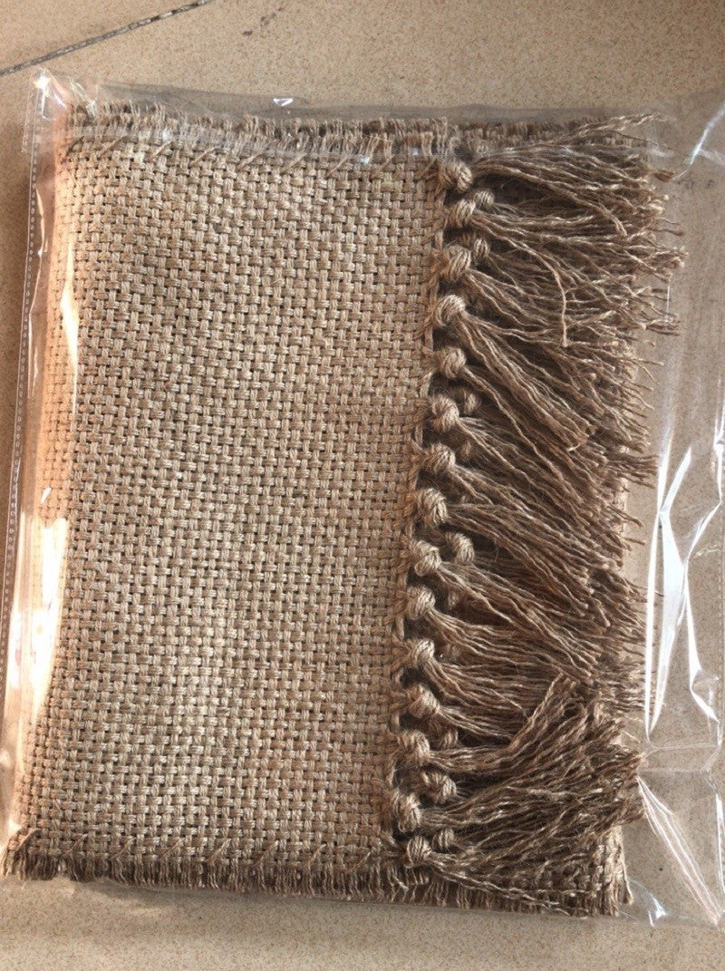 Textile with tassels on a clear background