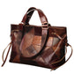 Brown leather patchwork handbag on a white background