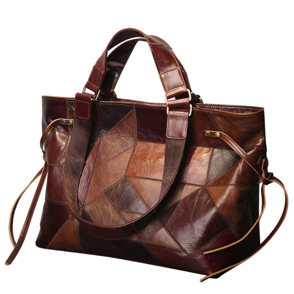 Brown leather patchwork handbag on a white background