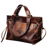 Brown leather patchwork handbag on a white background