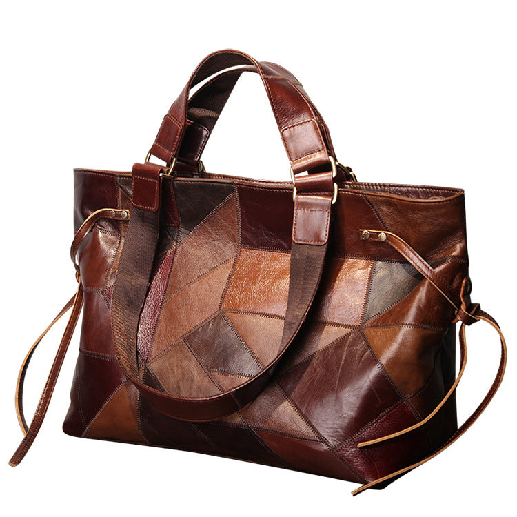 Brown leather patchwork handbag on a white background