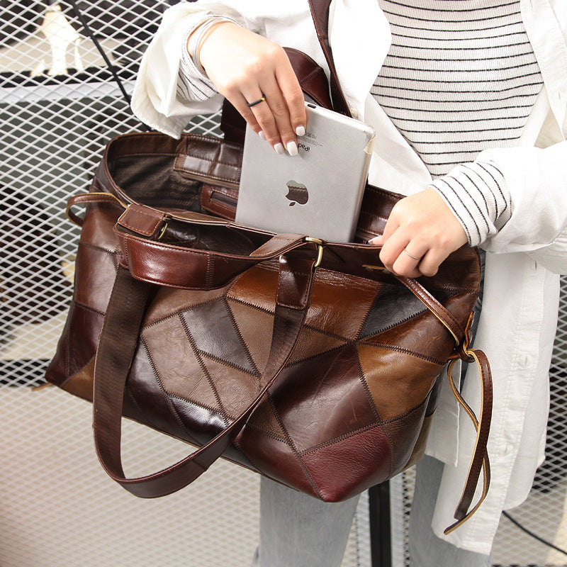 Person holding a brown leather bag with an Apple product inside, against a neutral background.