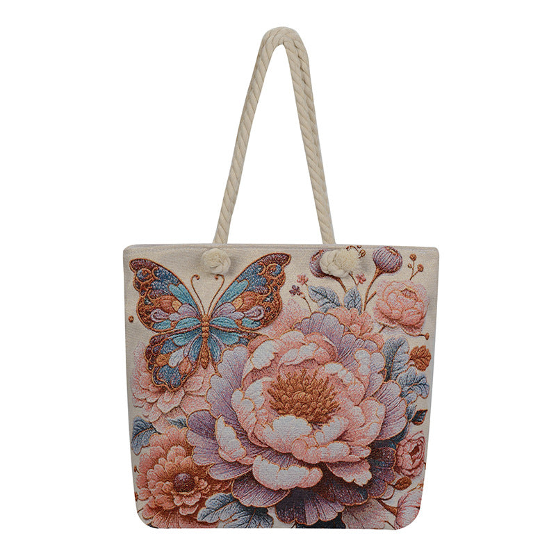 Tote bag with floral and butterfly design on a white background