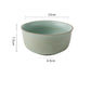 Green ceramic bowl with dimensions on a white background