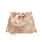 Decorative bag with floral patterns and pearl accents on a white background