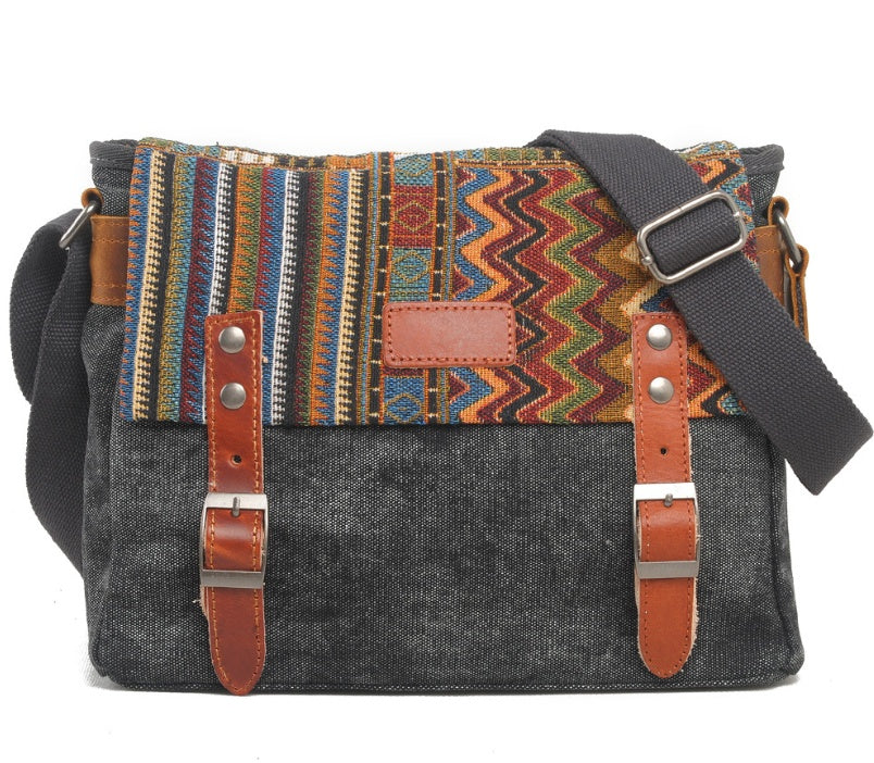 Multicolored patterned bag with gray body and brown straps on a white background