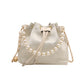 White drawstring bag with pearl chain on a white background