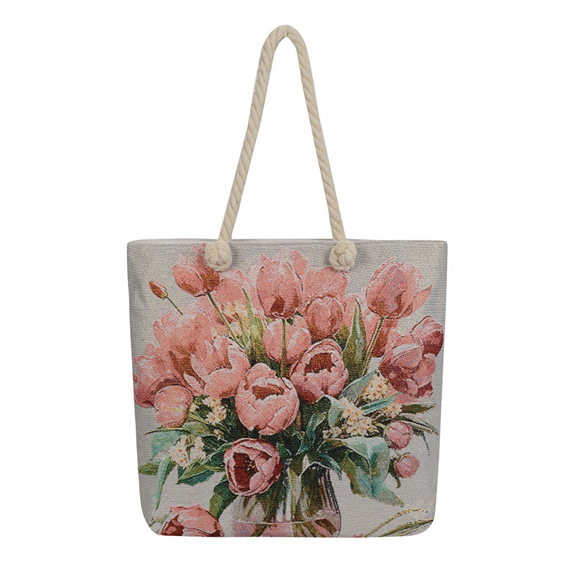 Tote bag with pink tulip design on a white background
