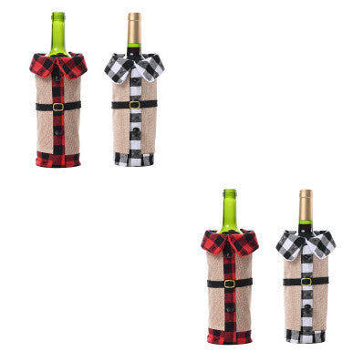 Set of four wine bottles wrapped in plaid and burlap covers on a white background