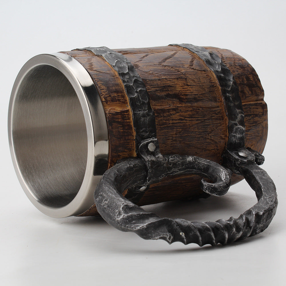 Wooden barrel with metal band and decorative element on a white background