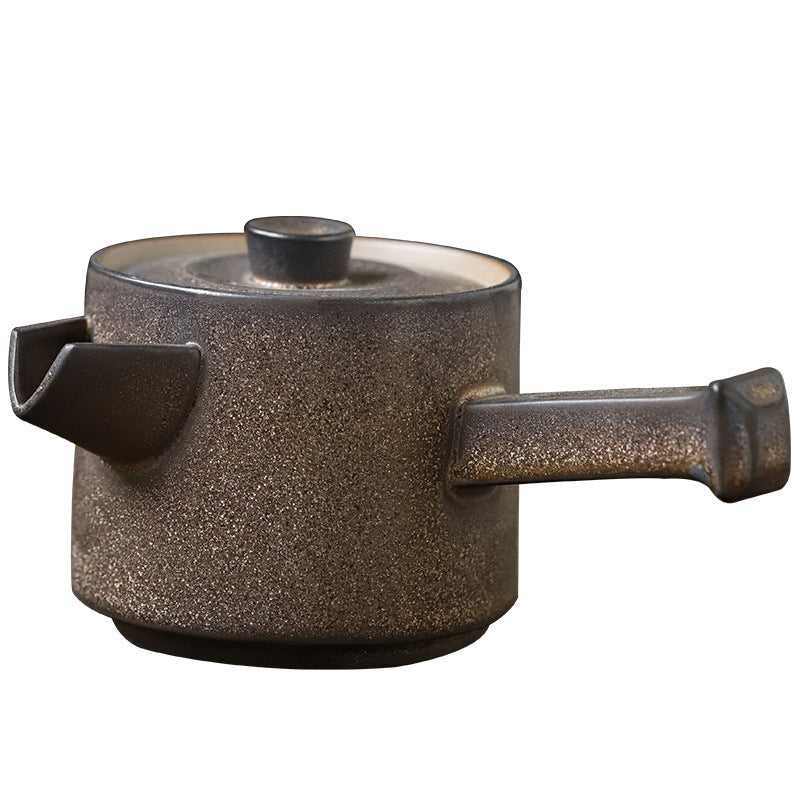 Brown ceramic pot with a handle on a white background