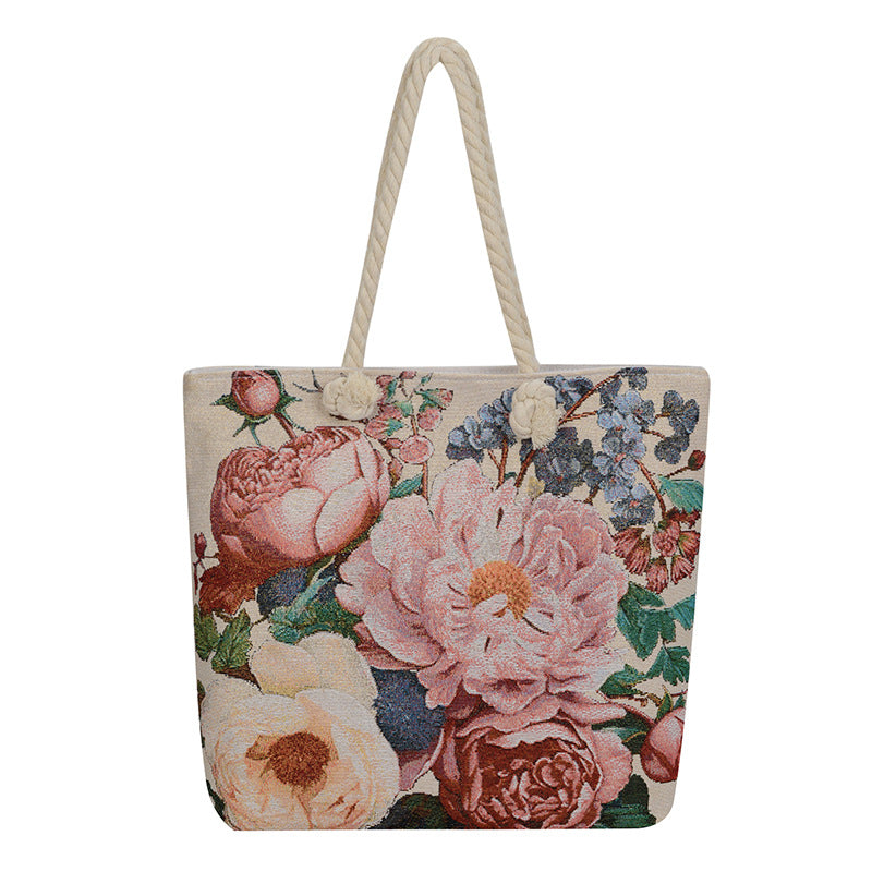 Floral tote bag with a rope handle on a white background