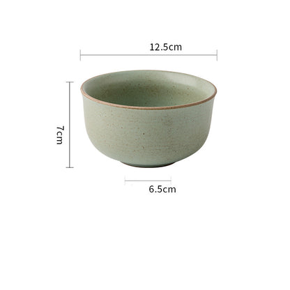 Green ceramic bowl with dimensions on a white background