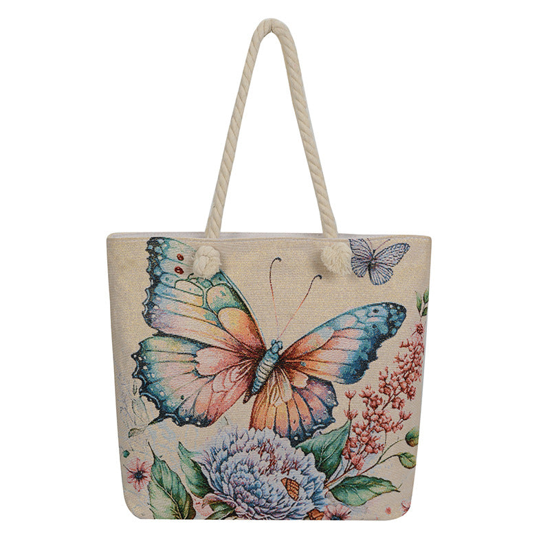 Tote bag with butterfly and floral design on a white background