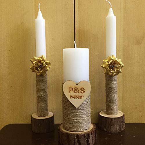 Three candles on wooden stands with decorative elements on a wooden background