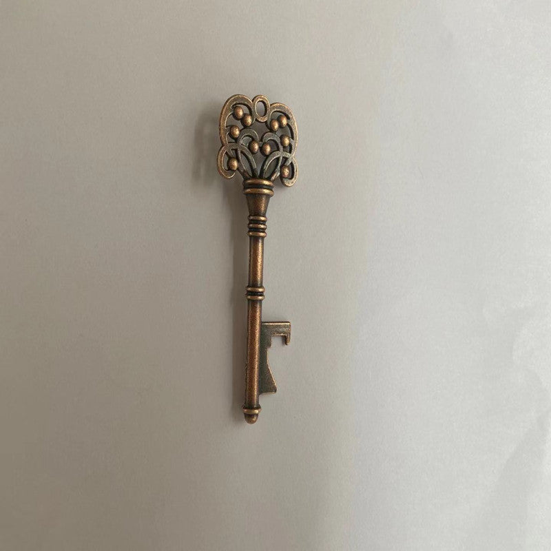 Decorative bronze key on a light gray background