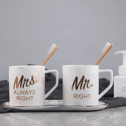 Two mugs labeled 'Mrs. Always Right' and 'Mr. Right' with toothbrushes on a gray background.