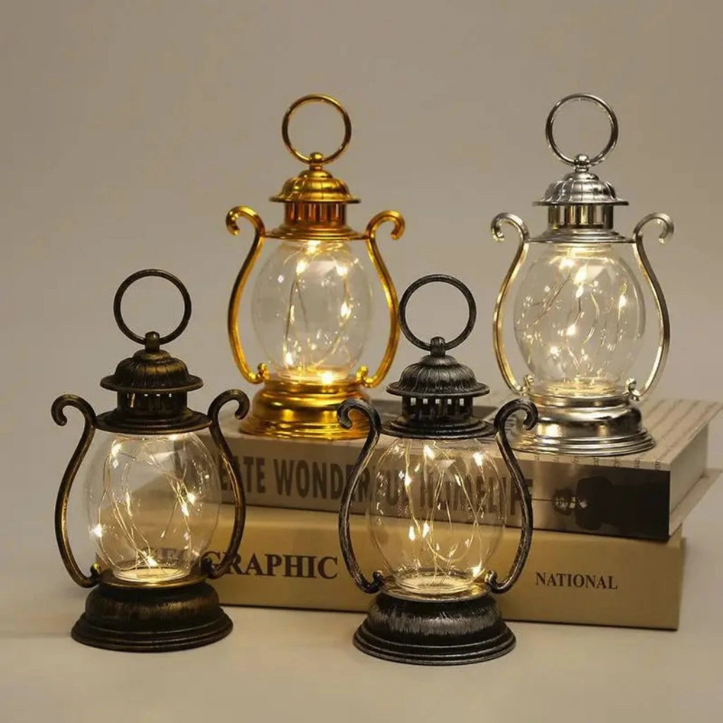 Set of four decorative lanterns with different finishes on a neutral background
