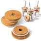 Wooden coasters with a central hole and jars with wooden lids and straws on a white background
