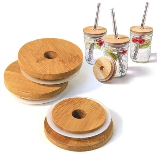 Wooden coasters with a central hole and jars with wooden lids and straws on a white background