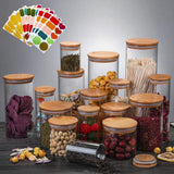 Set of glass jars with wooden lids containing various food items on a gray background.