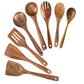 Set of wooden kitchen utensils including spoons and spatulas on a white background