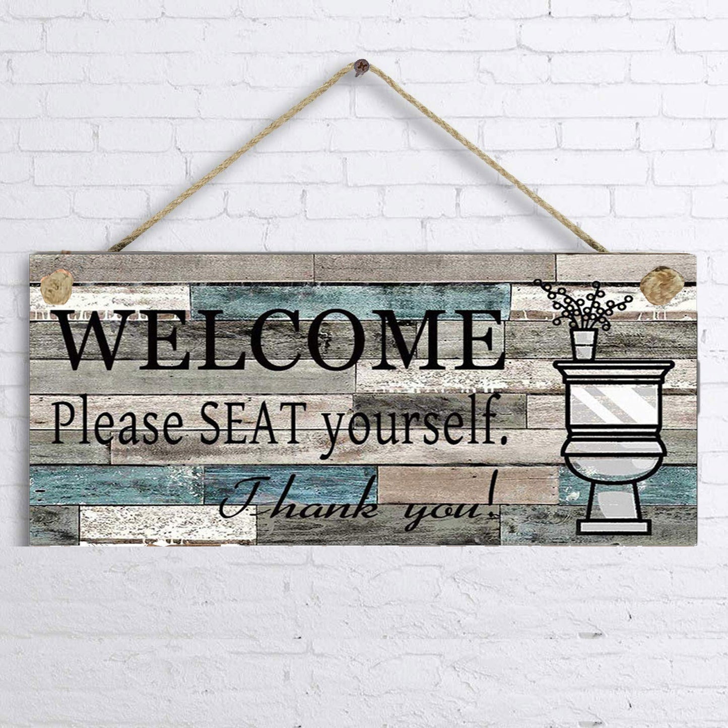 Wooden sign with 'Welcome Please Seat Yourself Thank You' text on a white brick wall background