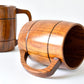 Wooden mug with barrel design on a white background