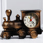 Bronze train-shaped clock on a white background