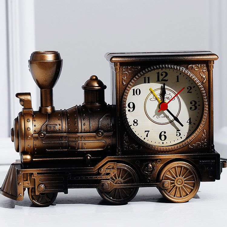 Bronze train-shaped clock on a white background