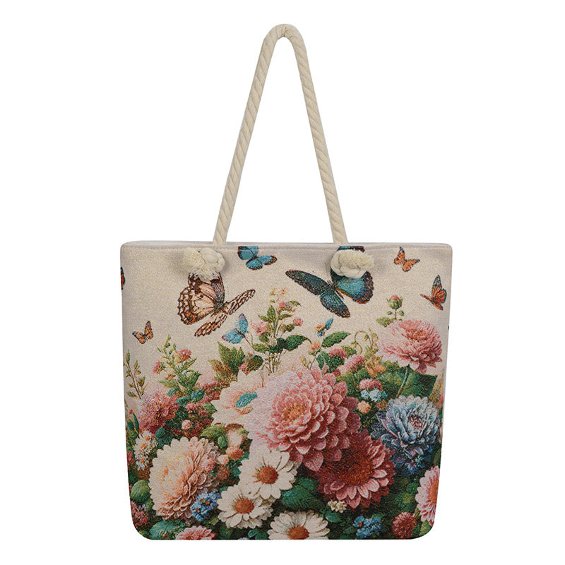 Tote bag with floral and butterfly design on a white background