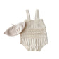 Baby romper with lace details and matching hat on a white background