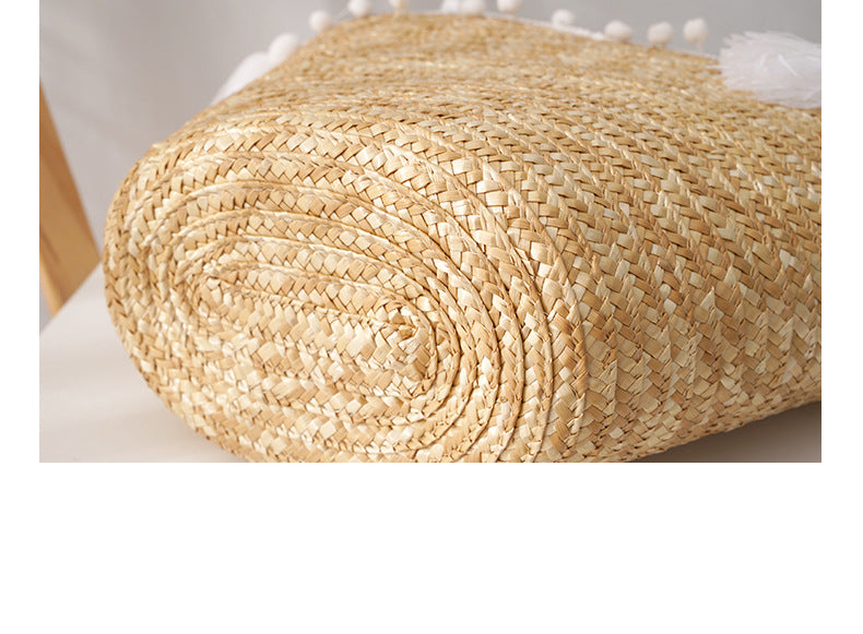 Rolled-up straw mat on a light background