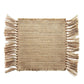 Beige woven placemat with fringe on a white background