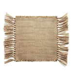 Beige woven placemat with fringe on a white background