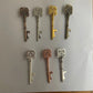 Set of decorative keys on a plain background