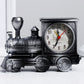 Vintage train-shaped clock on a white background
