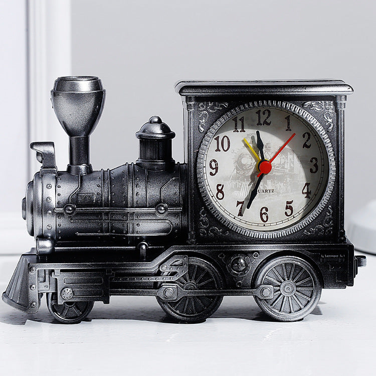 Vintage train-shaped clock on a white background