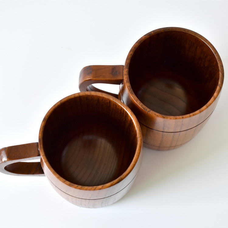 Two wooden mugs on a white background