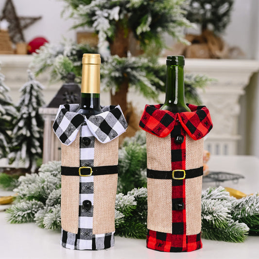 Two wine bottles wrapped in decorative covers with plaid patterns on a festive background.