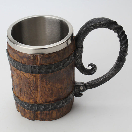 Wooden mug with metal handle and rim on a white background